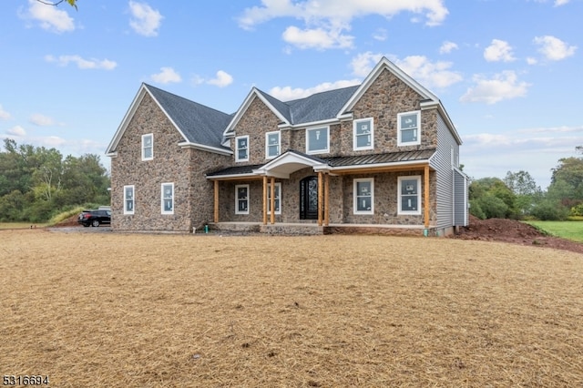 craftsman-style home featuring a front lawn