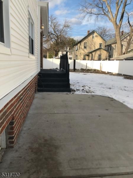 view of yard layered in snow