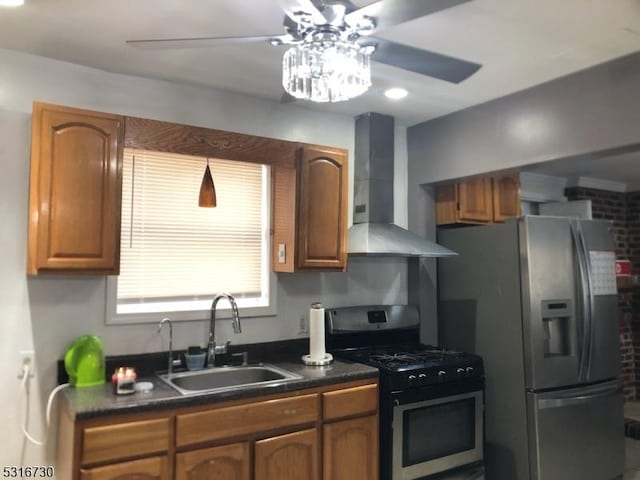 kitchen featuring sink, stainless steel appliances, wall chimney exhaust hood, and ceiling fan