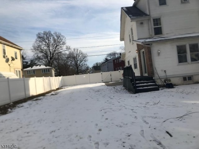 view of yard covered in snow