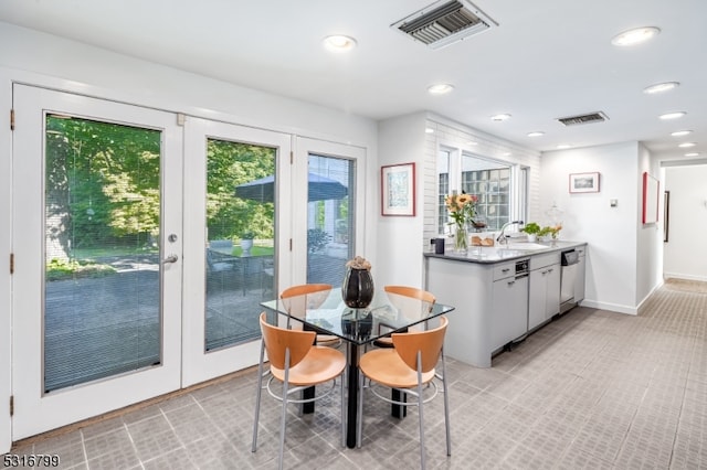 dining space featuring french doors