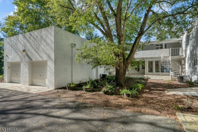 view of side of property featuring a garage