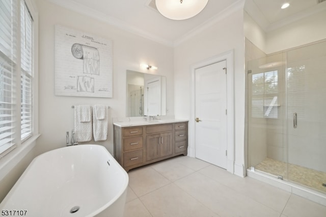 bathroom with vanity, shower with separate bathtub, tile patterned flooring, and crown molding