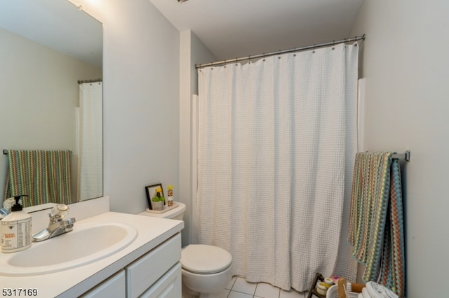 bathroom featuring vanity, toilet, and tile patterned floors