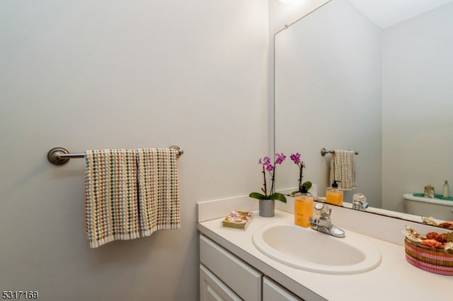 bathroom with vanity and toilet