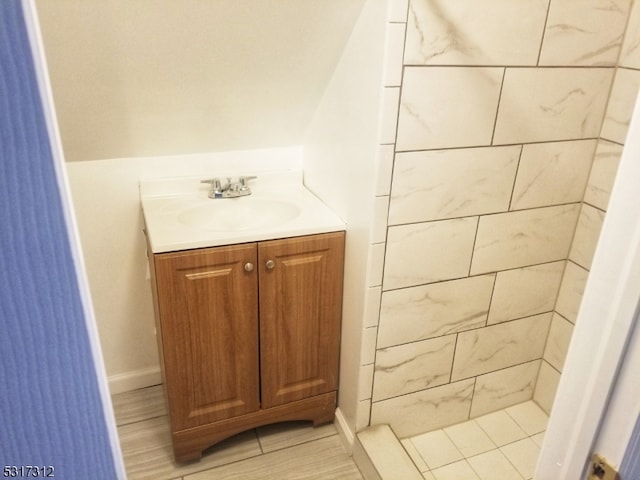 bathroom featuring vanity and hardwood / wood-style flooring