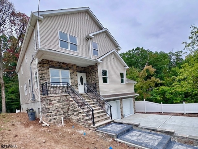 view of front of property with a garage