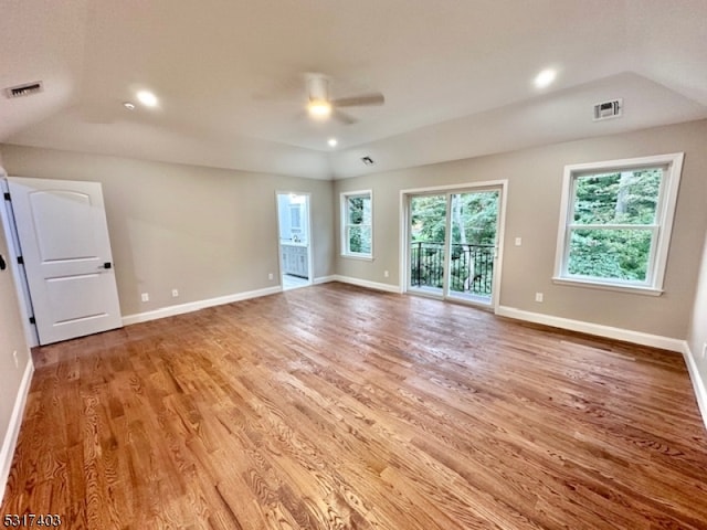 unfurnished room featuring vaulted ceiling, ceiling fan, and light hardwood / wood-style flooring