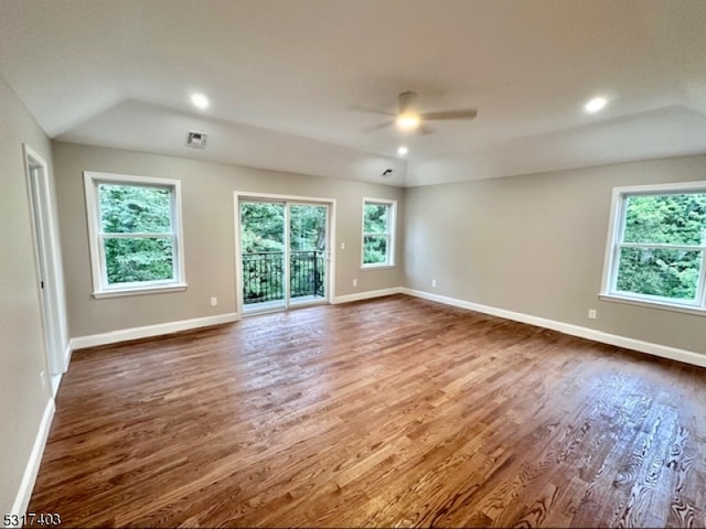 unfurnished room featuring vaulted ceiling, dark hardwood / wood-style flooring, and ceiling fan