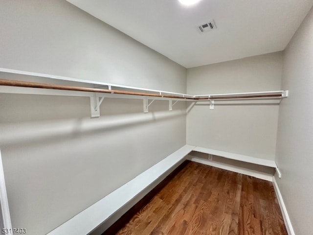 spacious closet featuring hardwood / wood-style floors