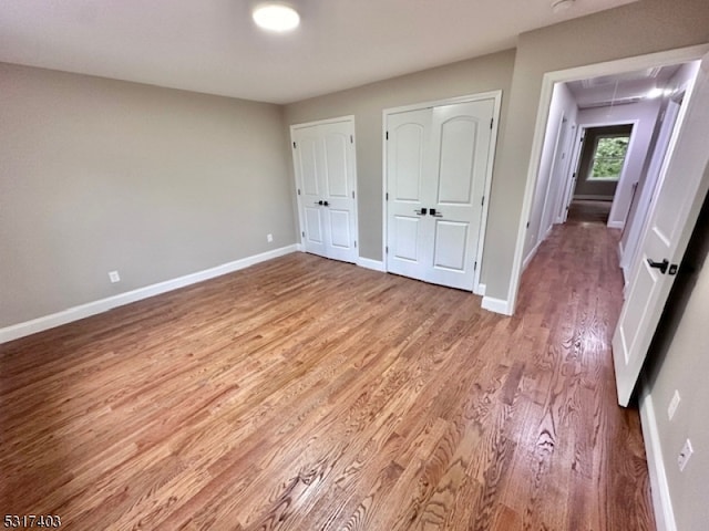 unfurnished bedroom featuring wood-type flooring