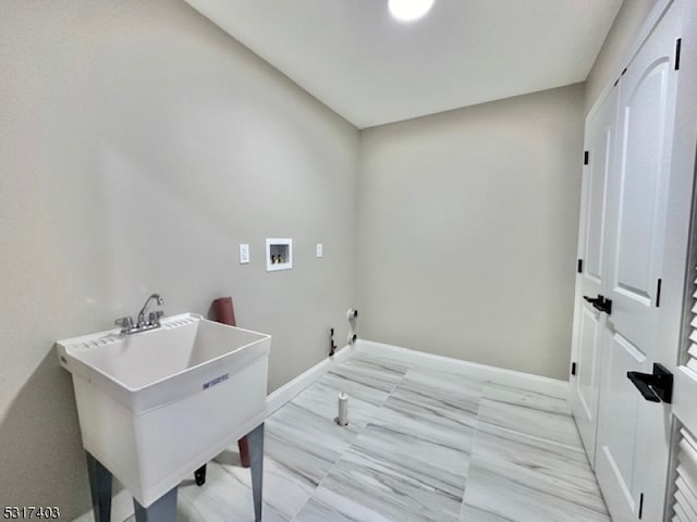 laundry room featuring gas dryer hookup, sink, and washer hookup