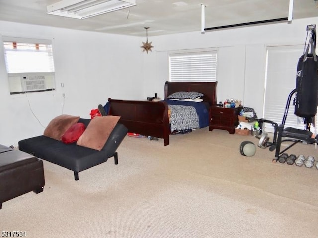 bedroom featuring cooling unit and carpet floors