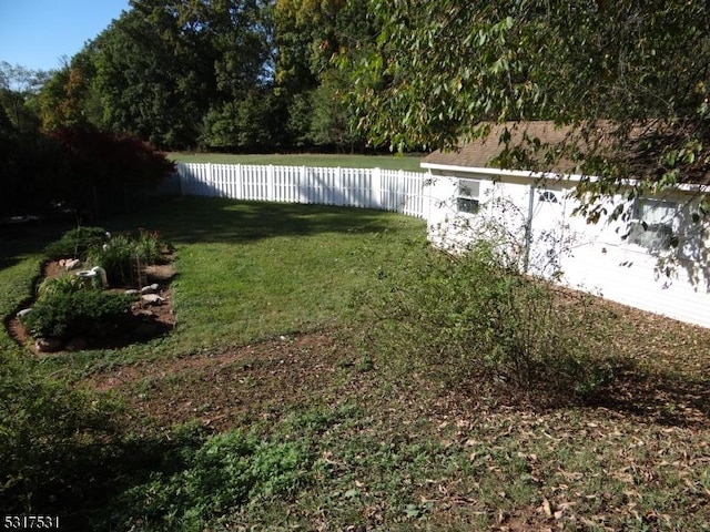 view of yard with a fenced backyard