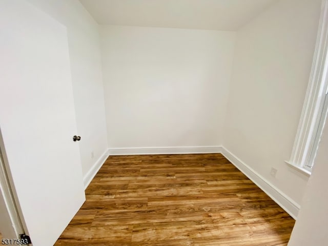 empty room with wood-type flooring