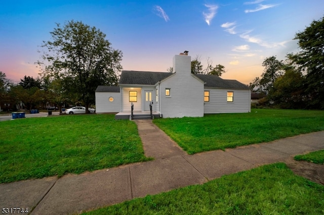 view of front of house with a yard