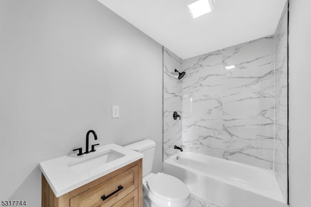 full bathroom featuring toilet, vanity, and tiled shower / bath