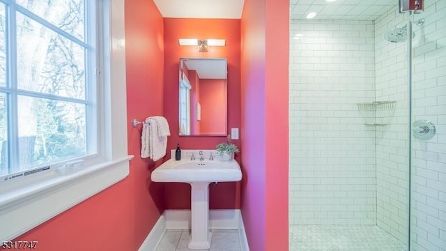 bathroom featuring tile patterned floors and an enclosed shower