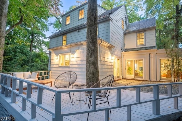 rear view of property with an outdoor hangout area and a deck