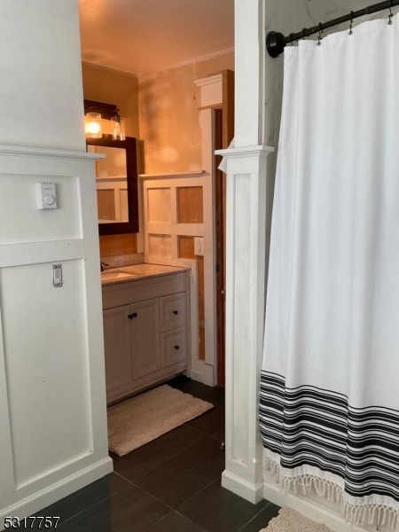 bathroom with vanity and a shower with shower curtain