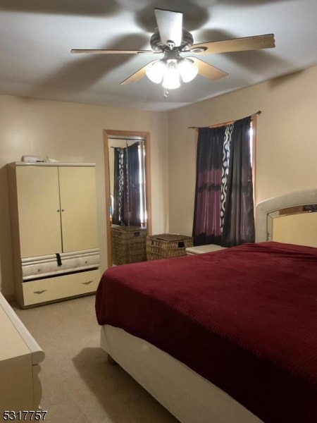 bedroom featuring ceiling fan