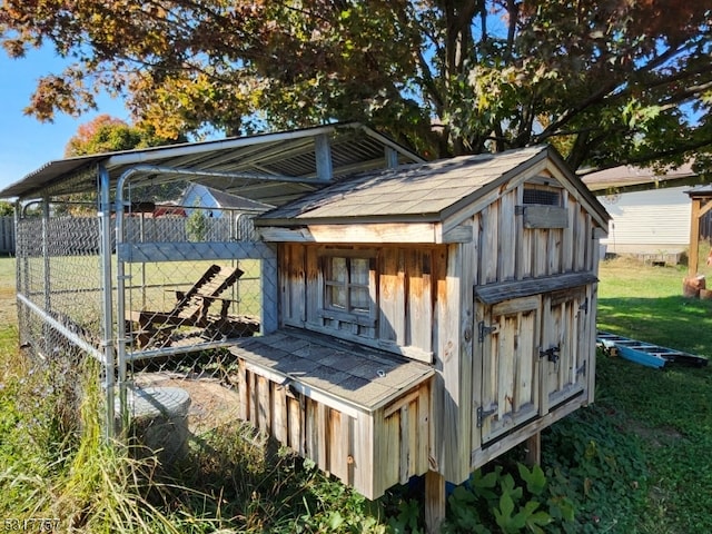 view of outdoor structure with a lawn