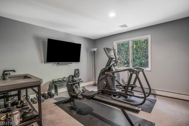 workout room featuring carpet