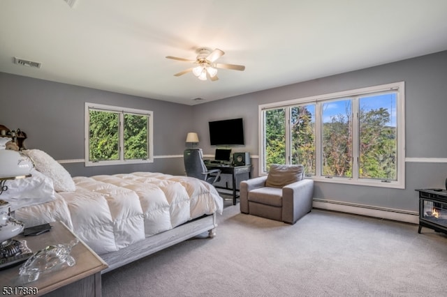 bedroom featuring ceiling fan, carpet floors, and baseboard heating