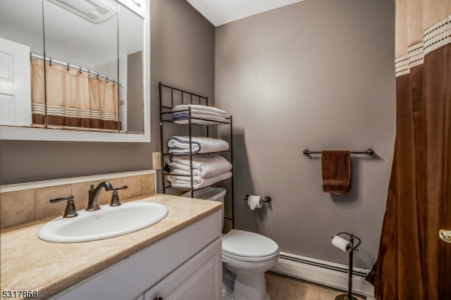 bathroom featuring tile patterned floors, vanity, toilet, and baseboard heating