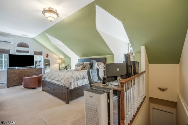 bedroom featuring vaulted ceiling with skylight, a wall mounted AC, and light carpet