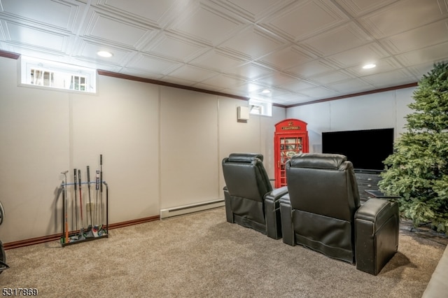 carpeted home theater with ornamental molding and baseboard heating