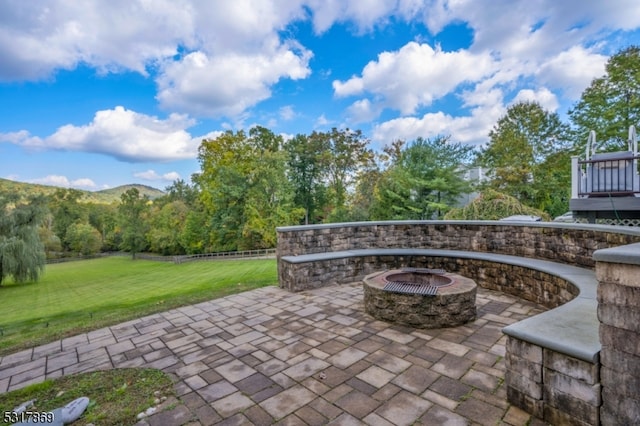 view of patio with an outdoor fire pit