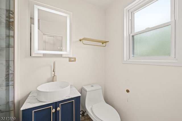 bathroom with vanity and toilet