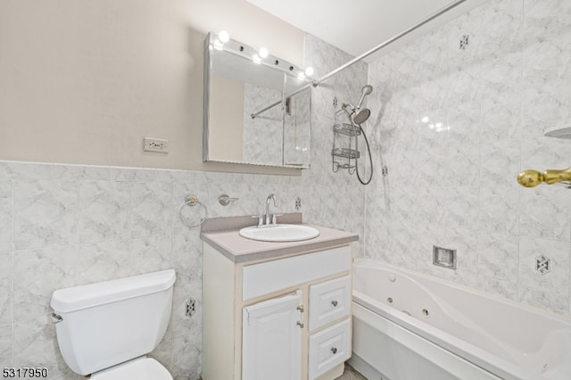 full bathroom featuring vanity, tile walls, tiled shower / bath combo, and toilet