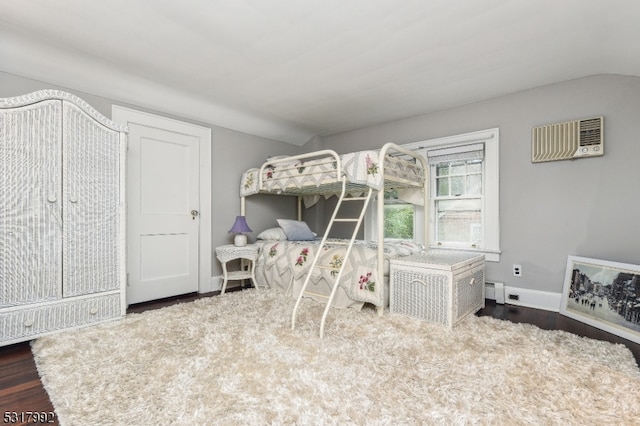 bedroom with dark wood-type flooring and vaulted ceiling