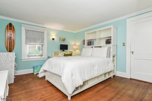 bedroom featuring ornamental molding and dark wood-type flooring