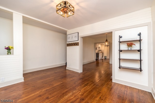 unfurnished room featuring dark hardwood / wood-style flooring