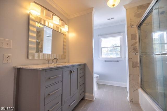 full bathroom featuring bath / shower combo with glass door, crown molding, vanity, and toilet