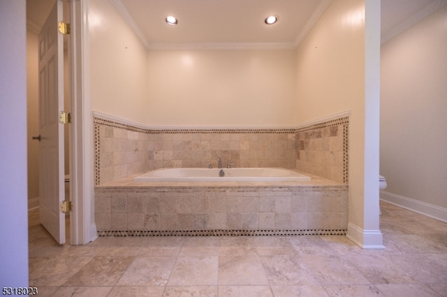 bathroom with tiled tub, ornamental molding, and toilet