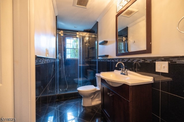 bathroom with vanity, ornamental molding, tile walls, toilet, and a shower with door