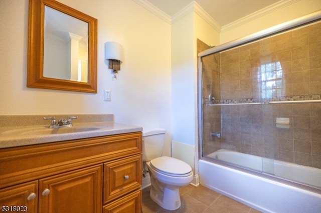 full bathroom featuring vanity, enclosed tub / shower combo, tile patterned floors, crown molding, and toilet