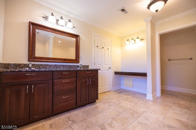 bathroom with vanity and crown molding