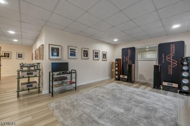 playroom with recessed lighting, wood finished floors, baseboards, and a drop ceiling