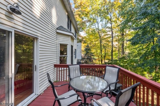 wooden deck with outdoor dining area