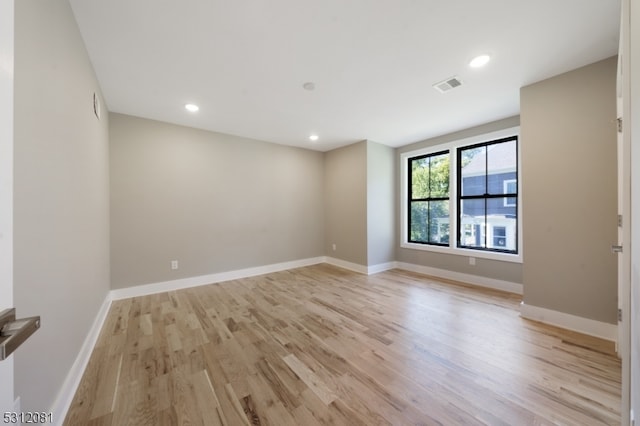 unfurnished room featuring light hardwood / wood-style flooring