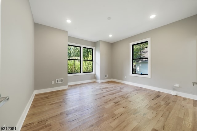 unfurnished room featuring light hardwood / wood-style flooring