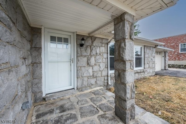 property entrance with a garage