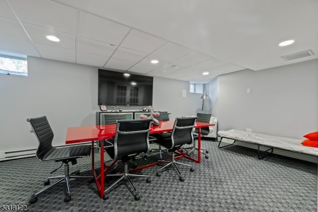 dining space featuring a paneled ceiling, a wealth of natural light, carpet floors, and baseboard heating