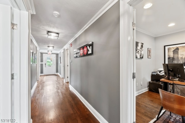 corridor with ornamental molding and wood-type flooring