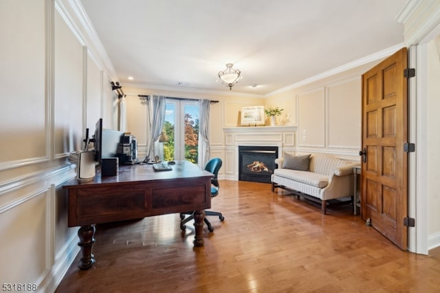 office featuring light hardwood / wood-style flooring and ornamental molding